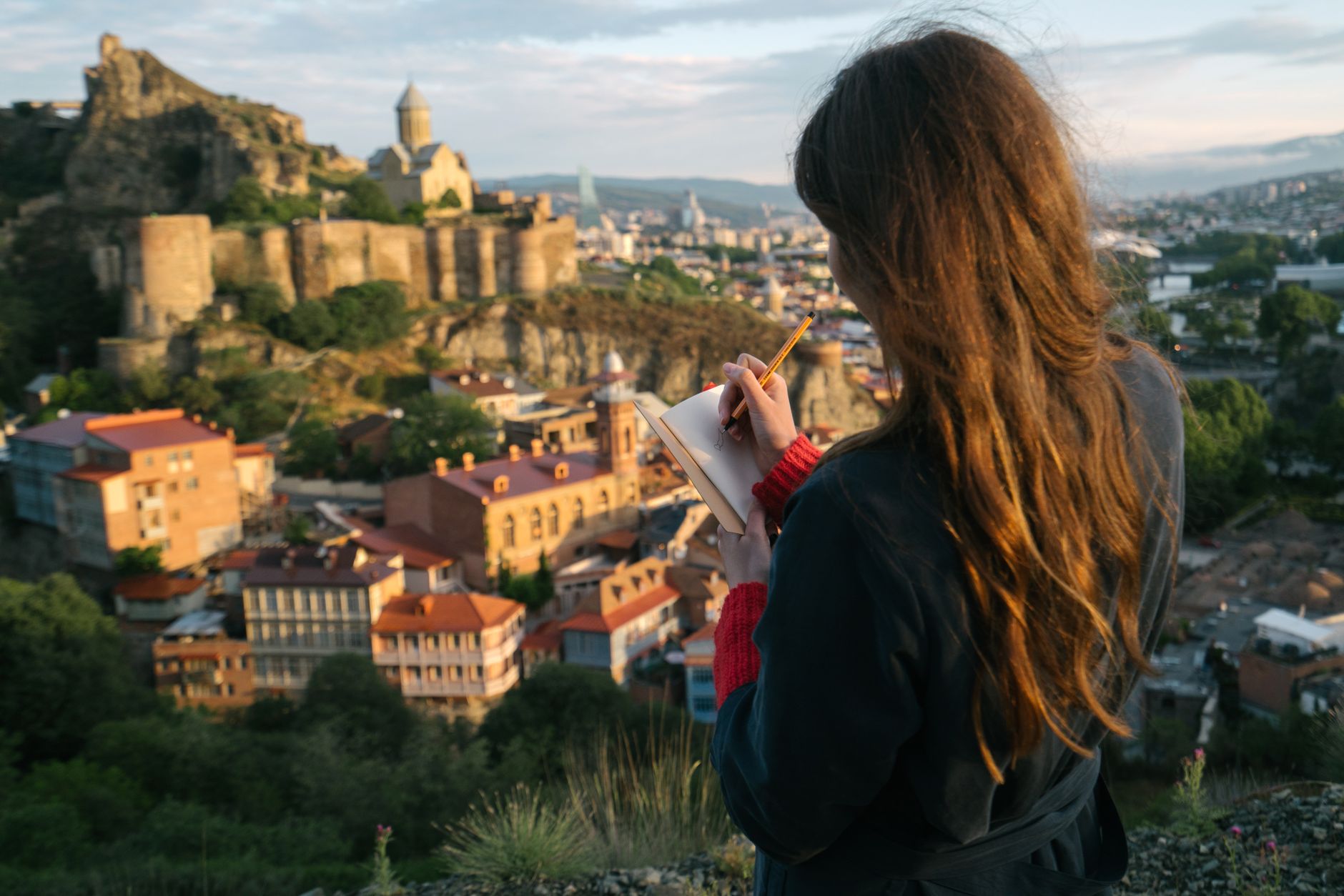 Travel writer documenting a village