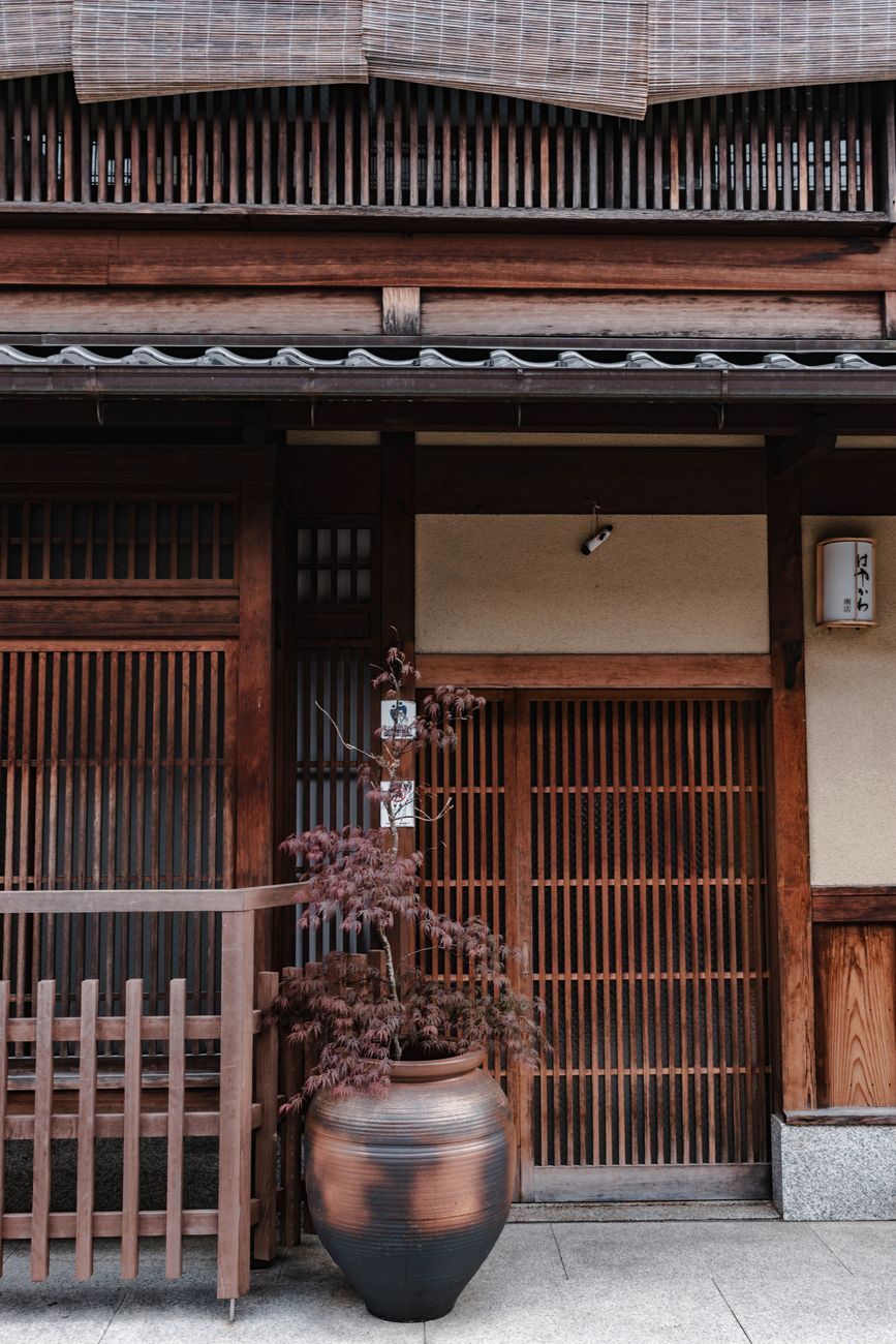 Traditional Japanese wooden room overlooking moss garden